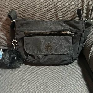 Kipling crossbody purse it’s black leopard